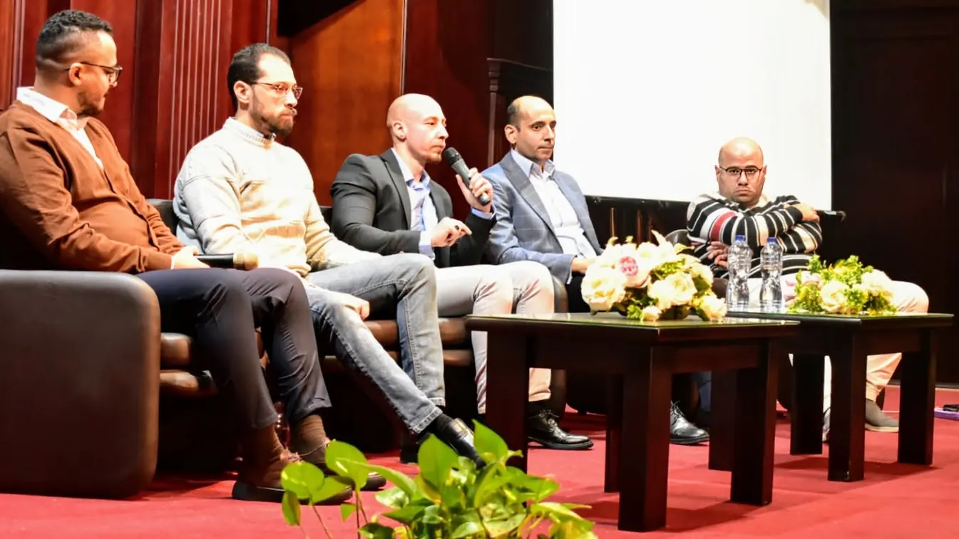 Five-speaker panel discussion on the Enhanced Summit stage