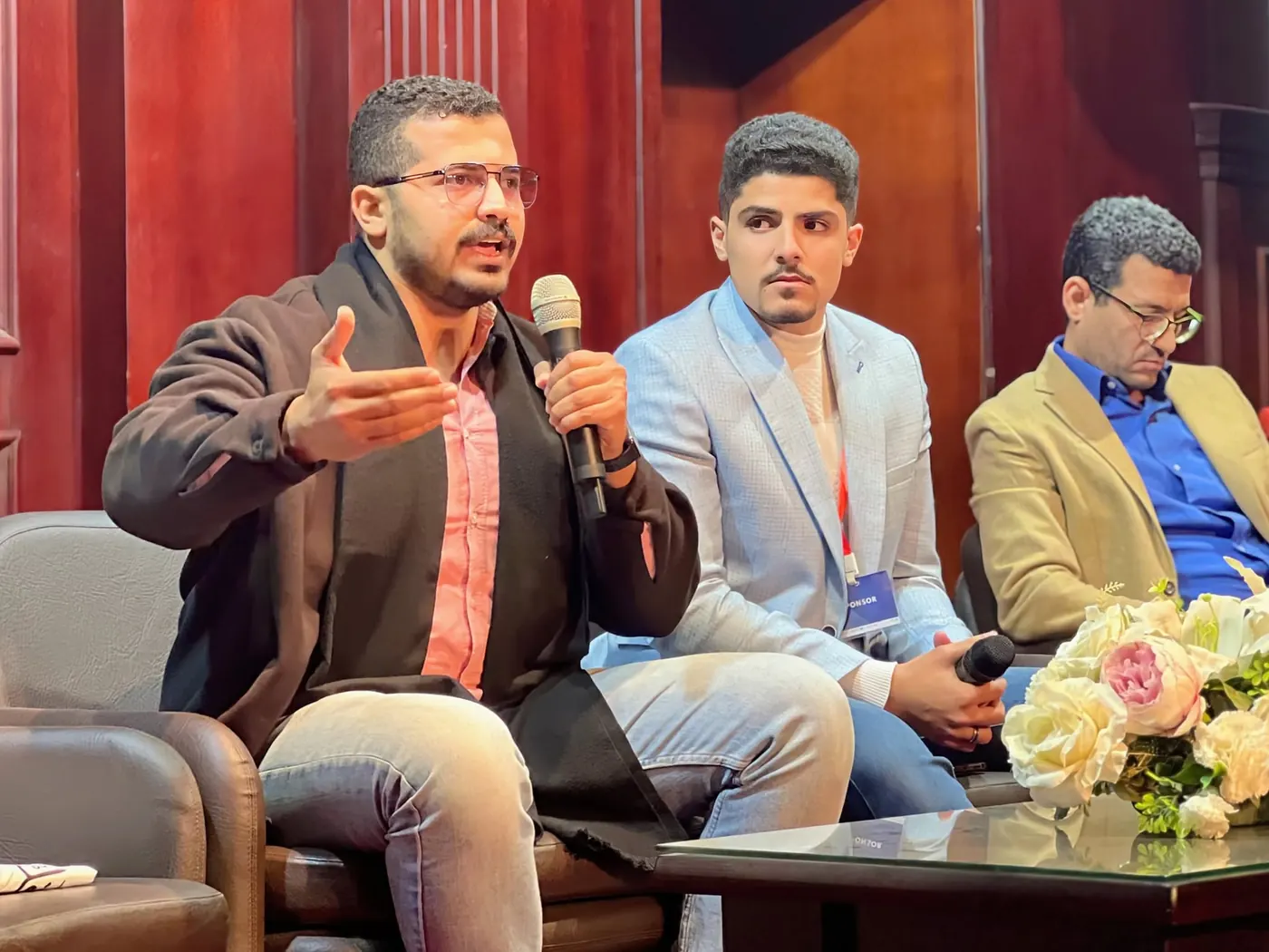 A speaker answering questions during an Enhanced Summit panel