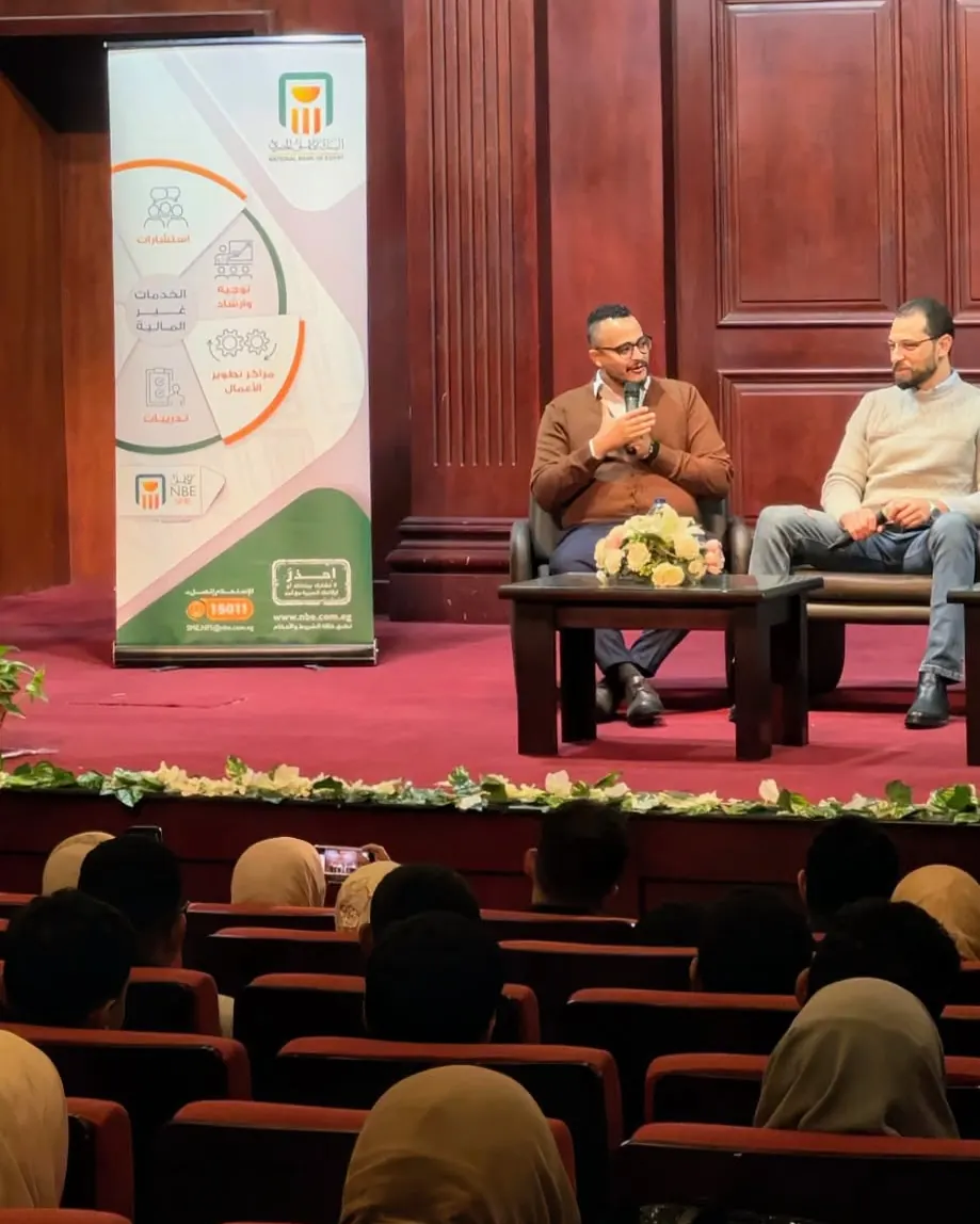 Panel on stage with the audience in front